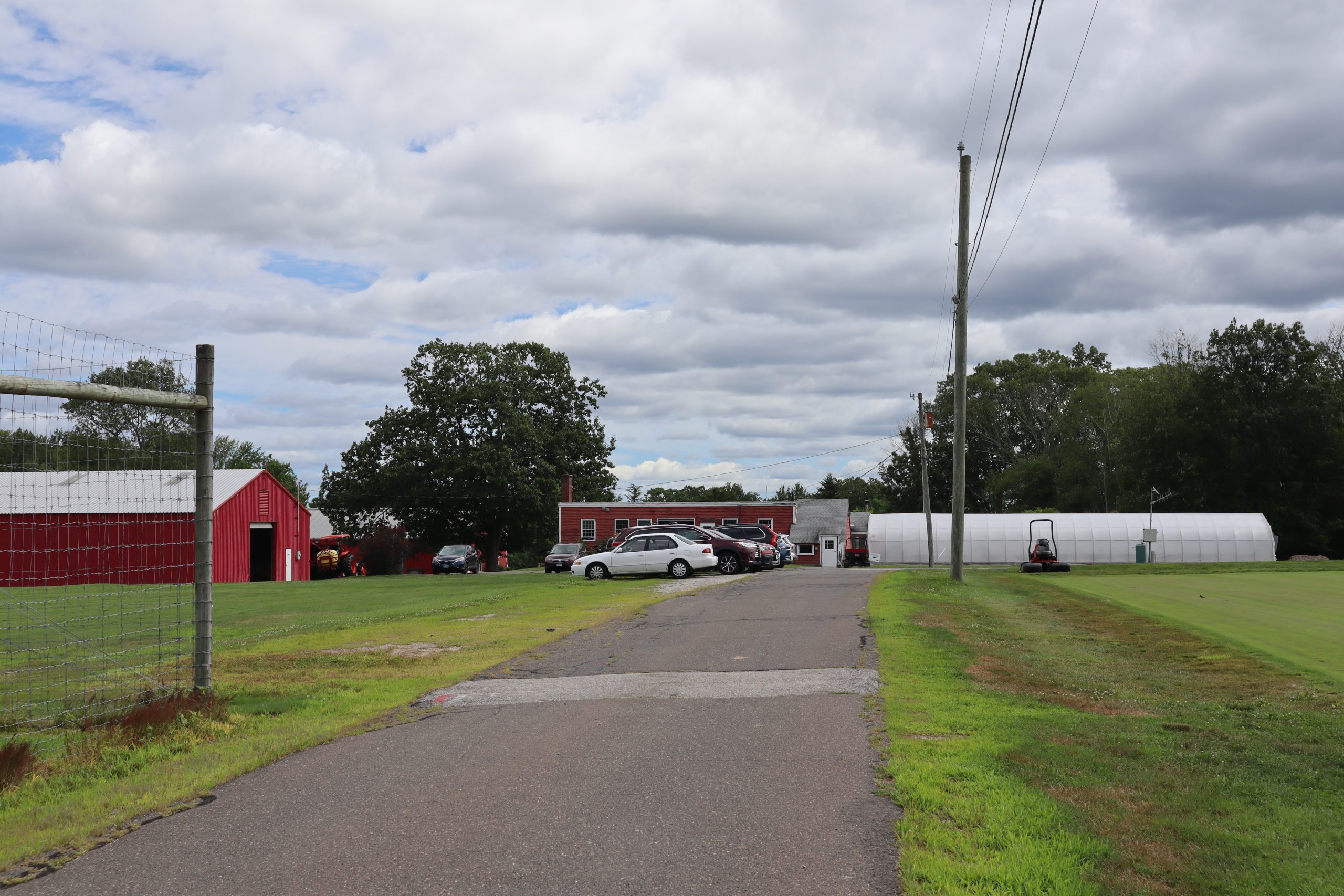 Parking along the side of the driveway at the research farm