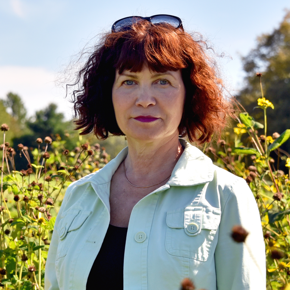 Julia Kuzovkina in a field of wildflowers